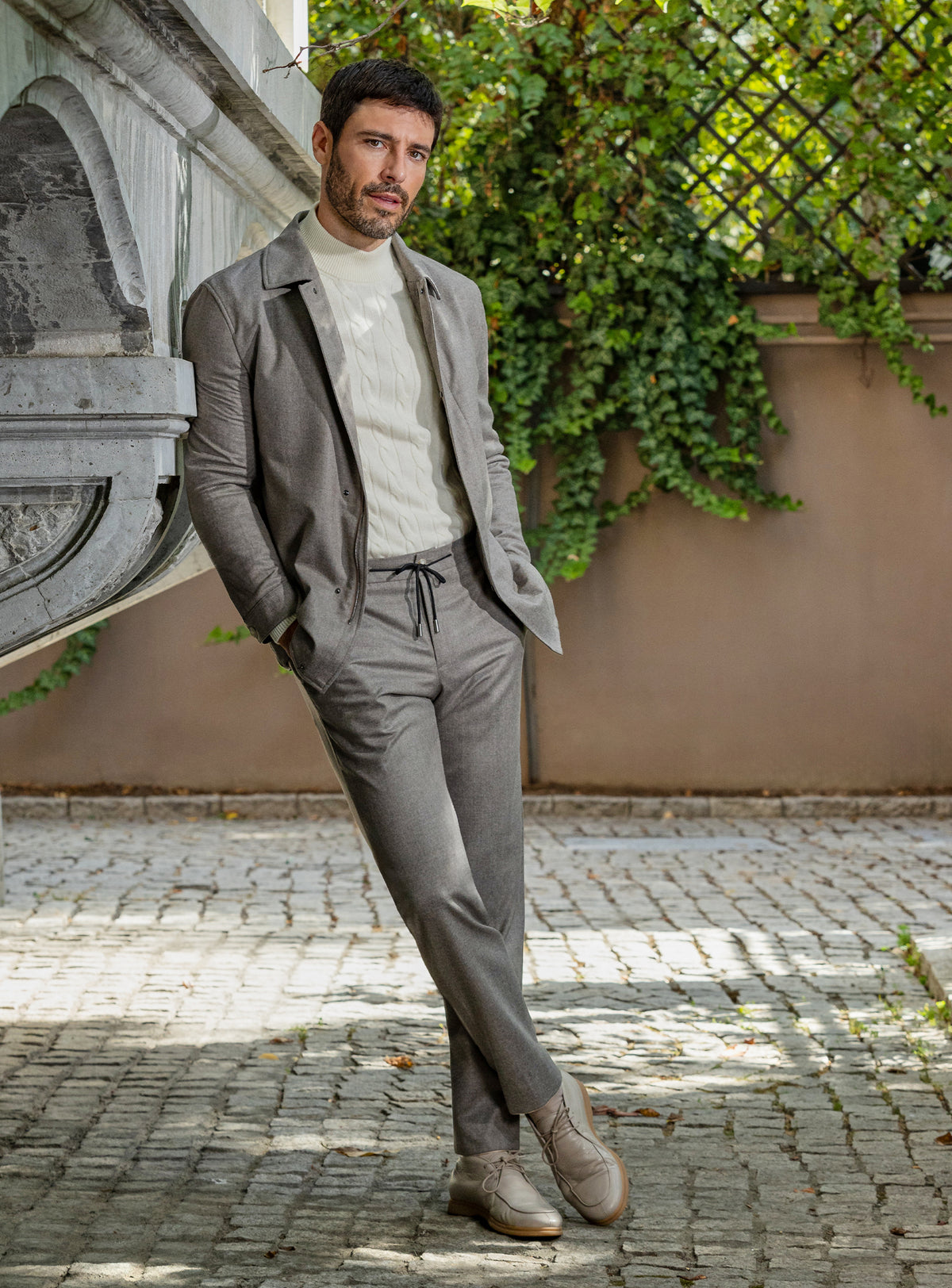 Consiglieri: taupe-grey jacket and trouser ensemble with an ivory roll-neck