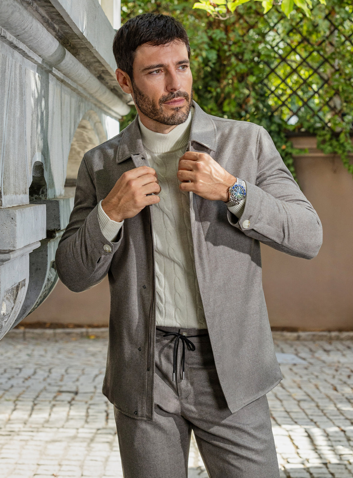 Consiglieri: taupe-grey jacket and trouser ensemble with an ivory roll-neck