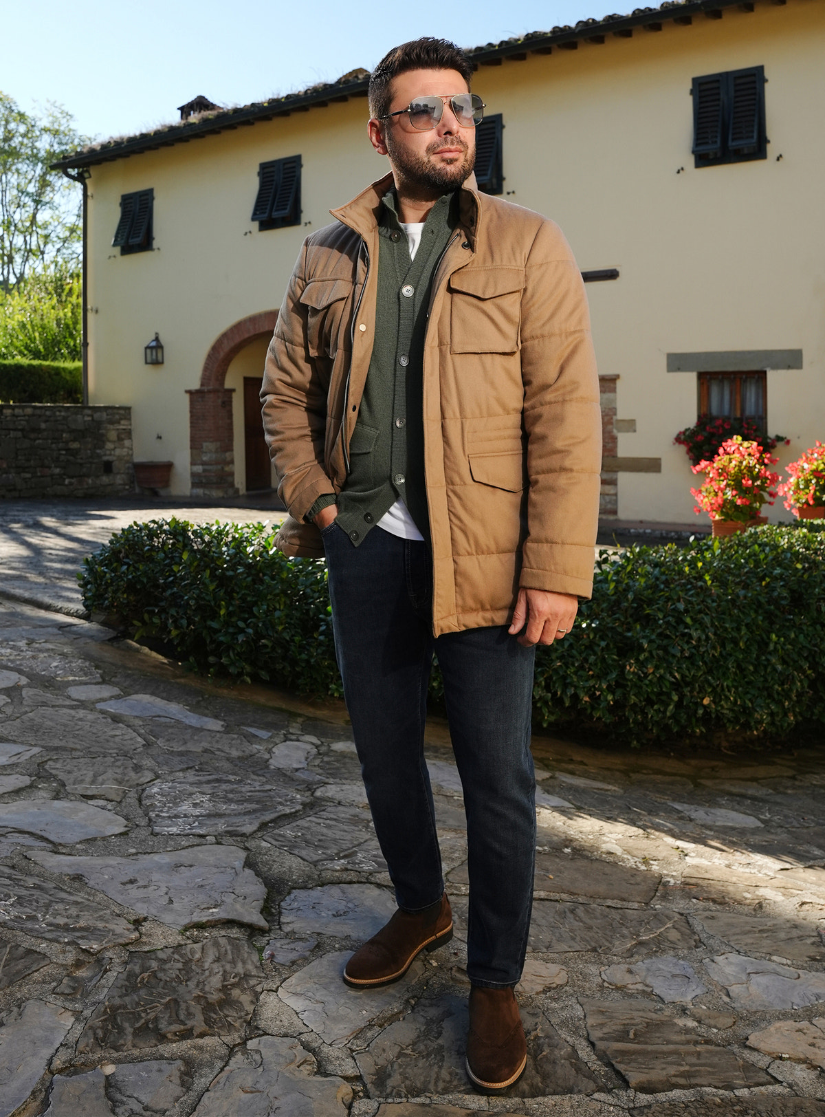 Navy Consiglieri jeans worn with a camel jacket and green cardigan