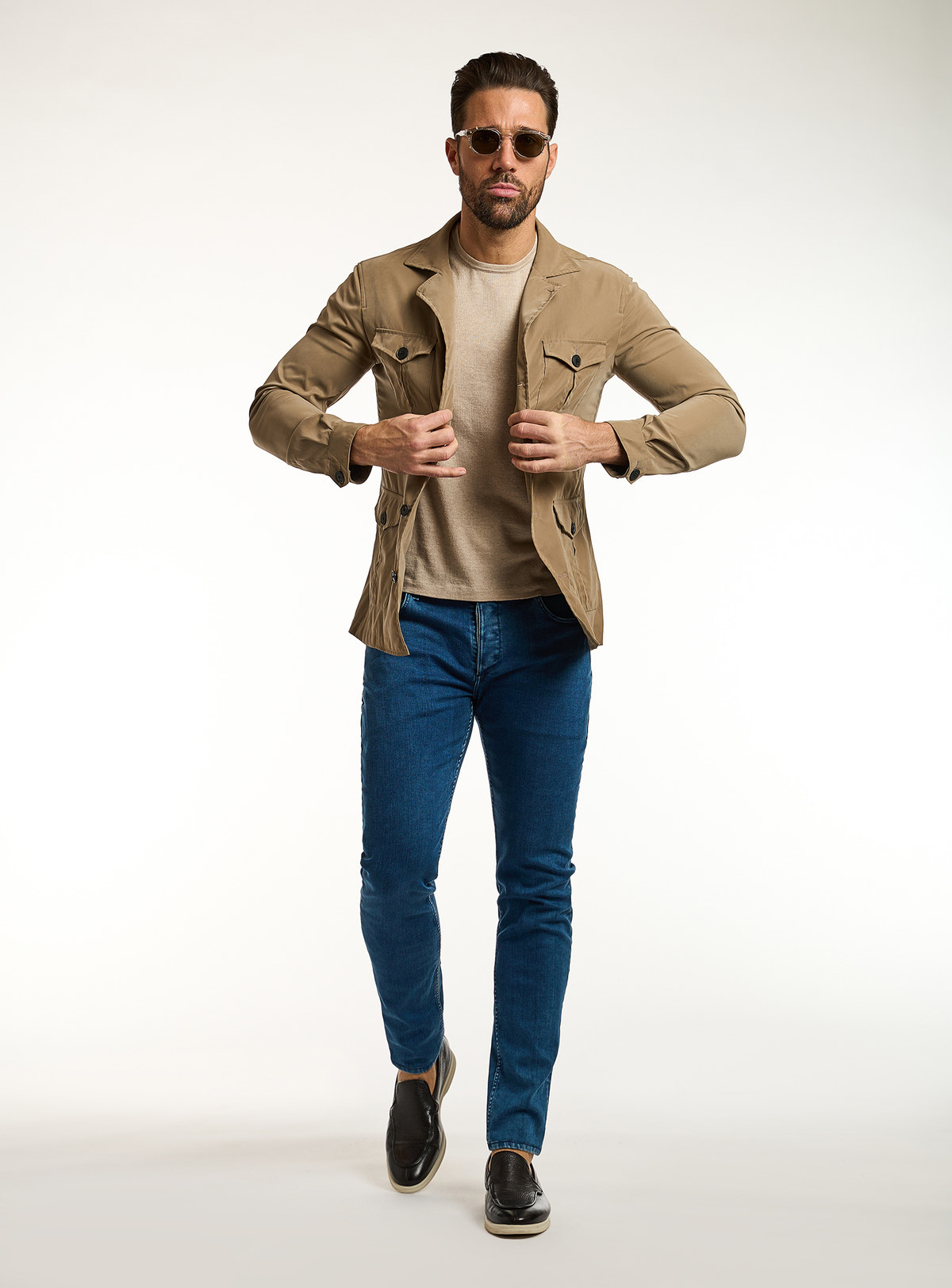 Consiglieri: beige T-shirt beneath a camel jacket with patch pockets