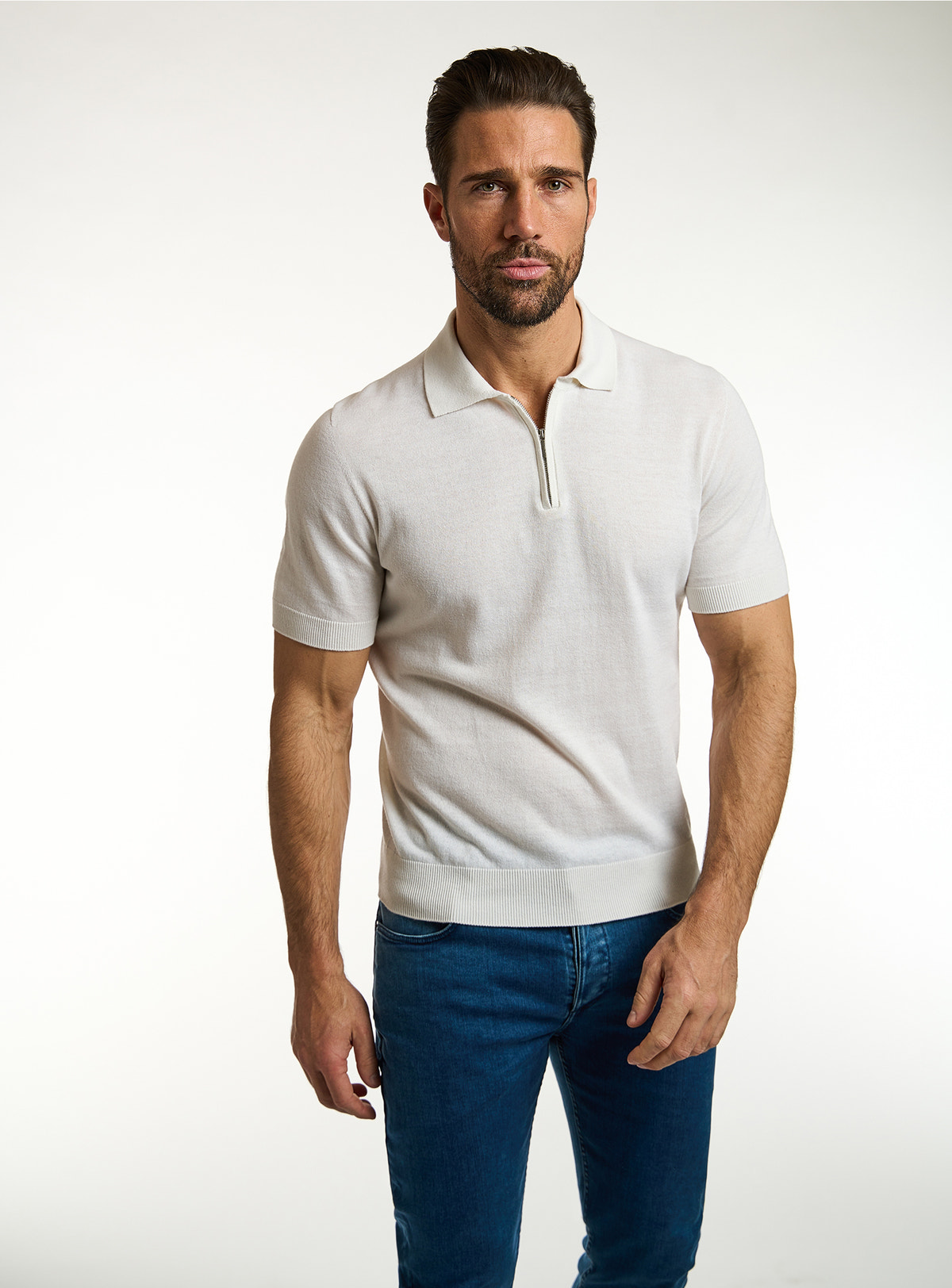 Consiglieri: ivory open-collar polo with blue jeans