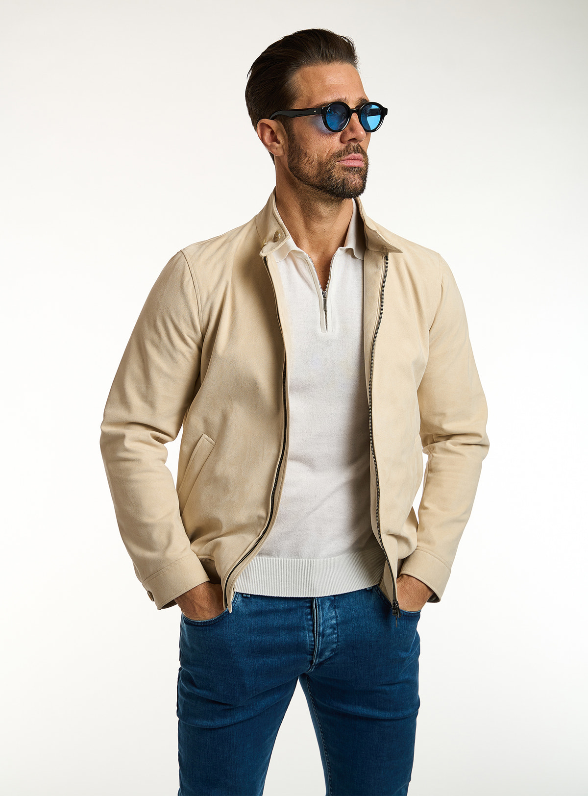 Consiglieri: ivory polo beneath a cream zip-front jacket