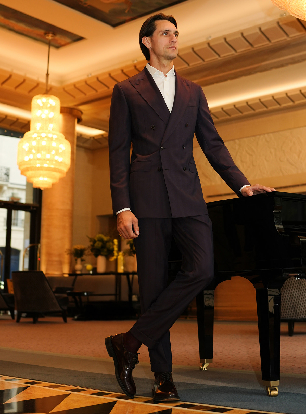 Plum-toned Consiglieri suit with a double-breasted jacket and white shirt