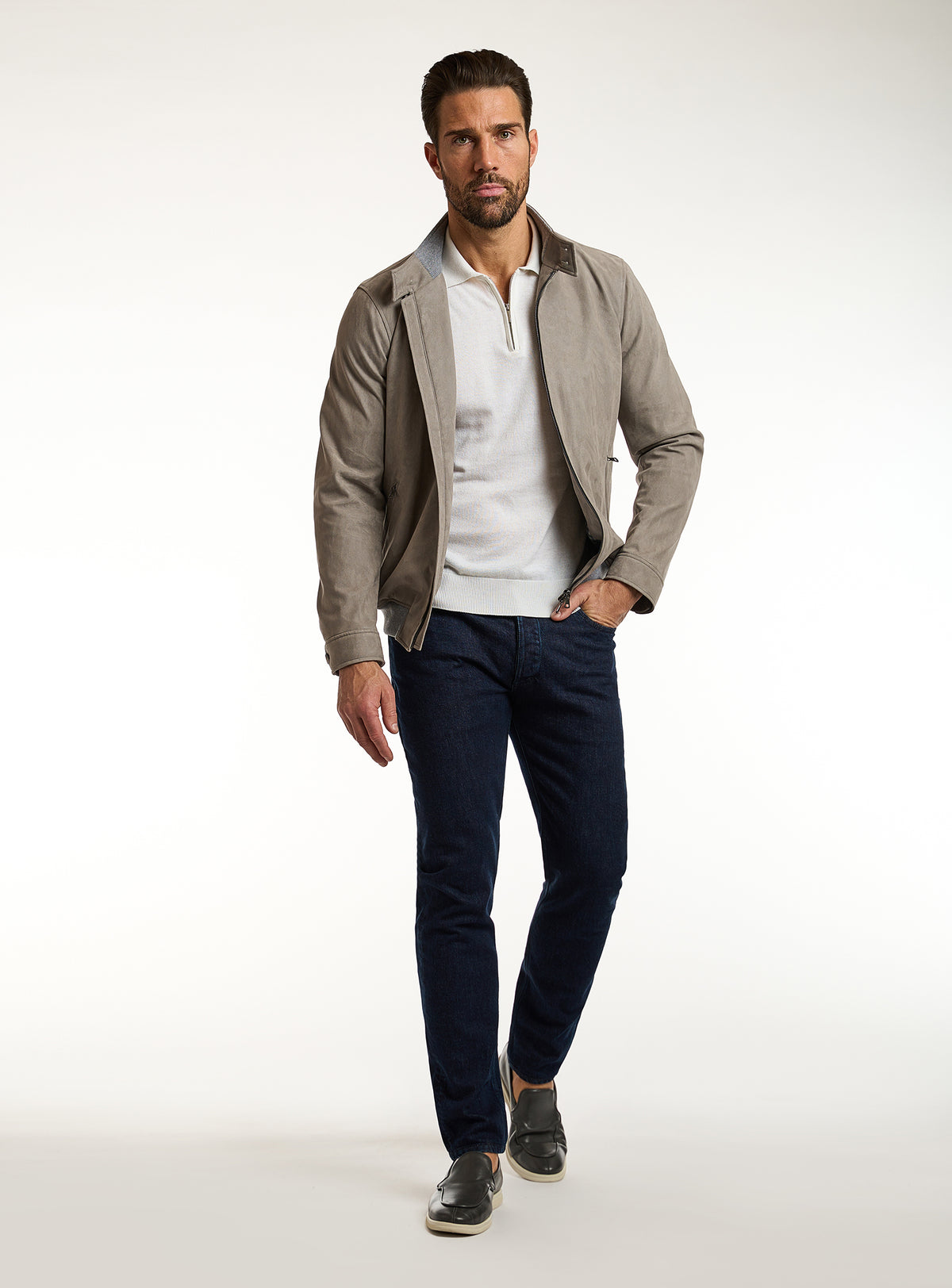 Consiglieri: taupe-grey zip-front jacket with an ivory polo and navy trousers