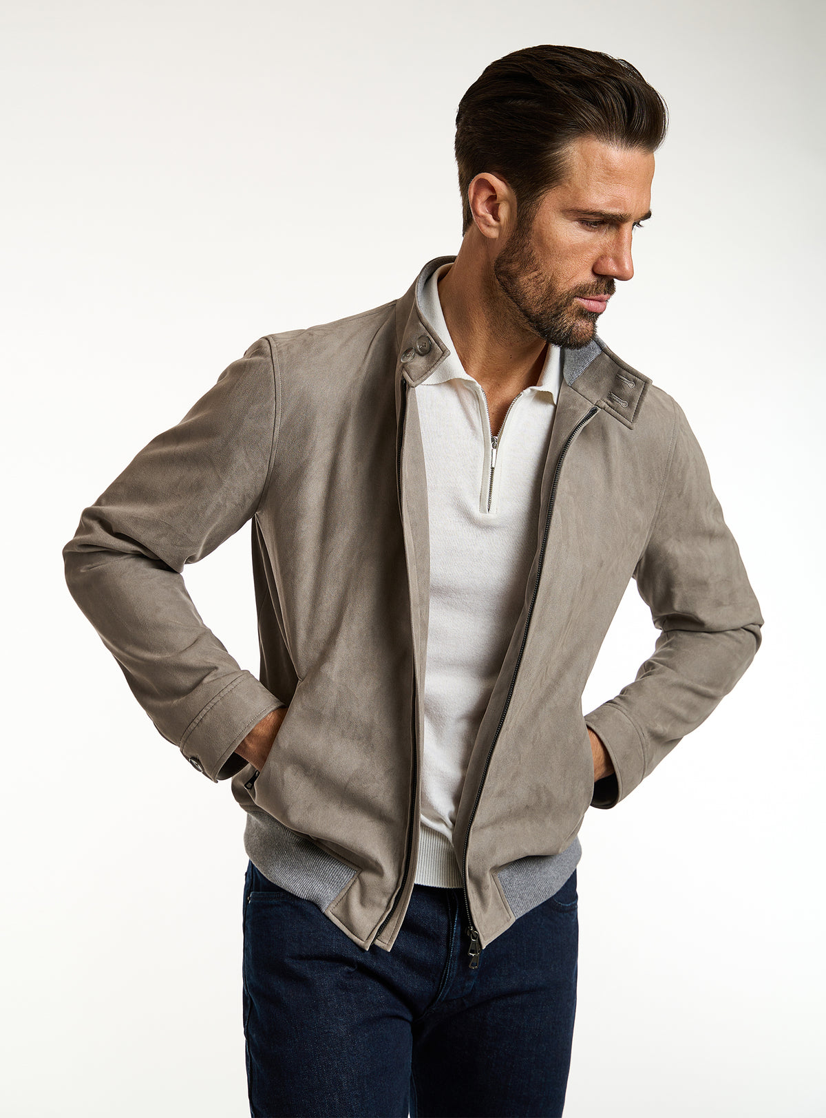 Consiglieri: taupe-grey zip-front jacket with an ivory polo and navy trousers