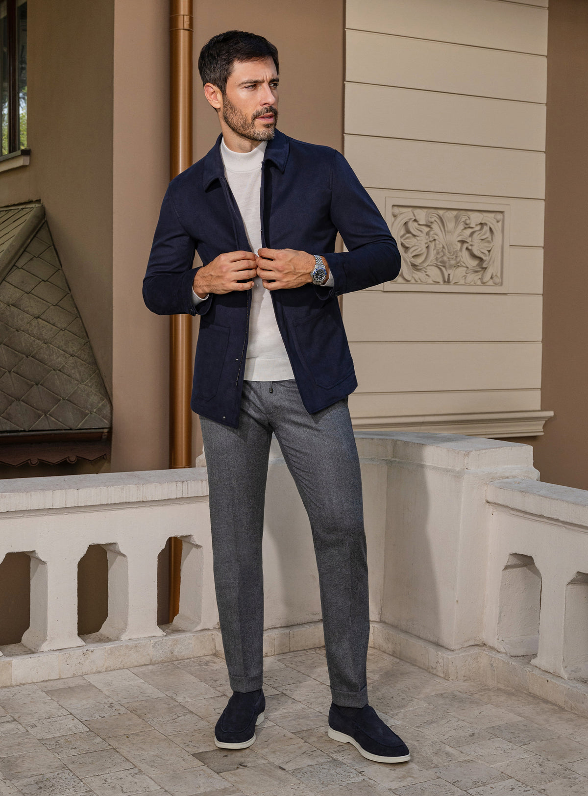 Consiglieri: navy jacket with an ivory roll-neck and grey trousers