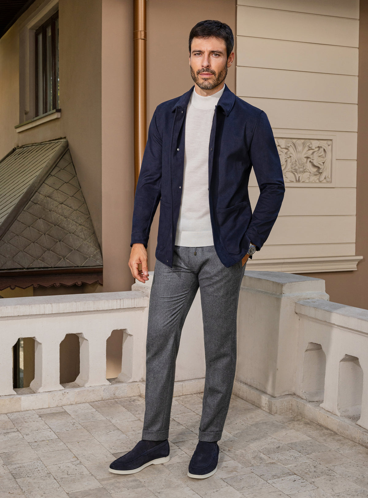 Consiglieri: navy jacket with an ivory roll-neck and grey trousers