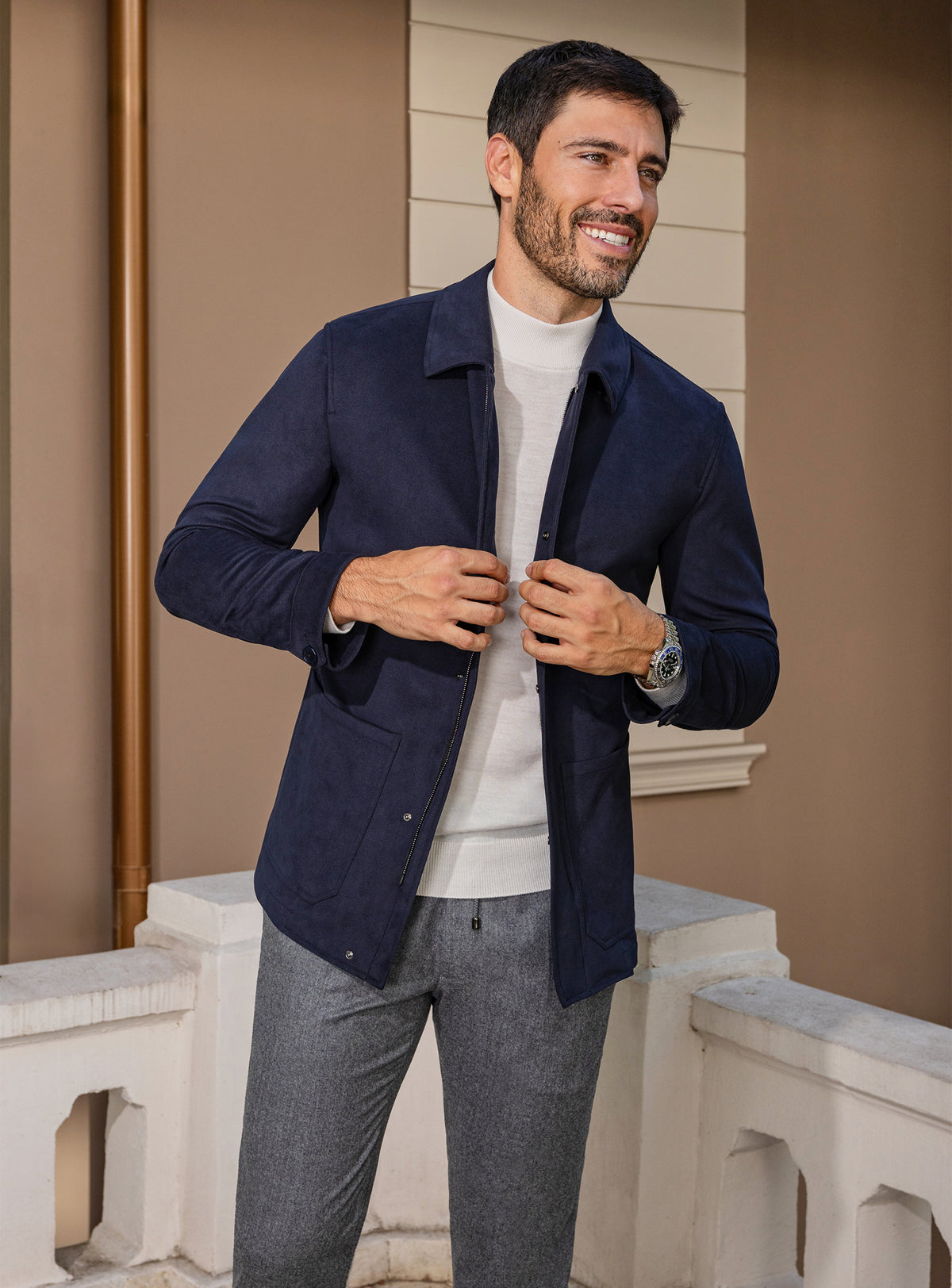 Consiglieri: navy jacket with an ivory roll-neck and grey trousers
