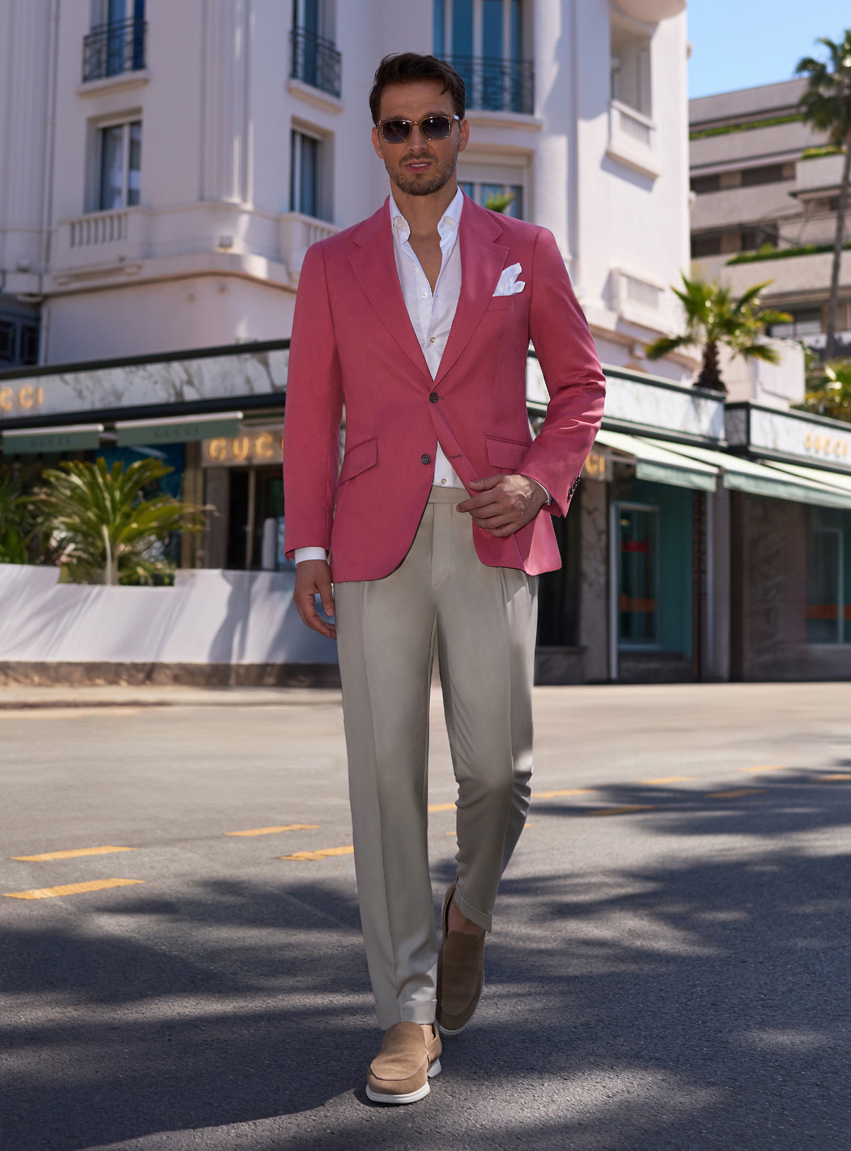Pink Consiglieri jacket worn with a white shirt and beige trousers