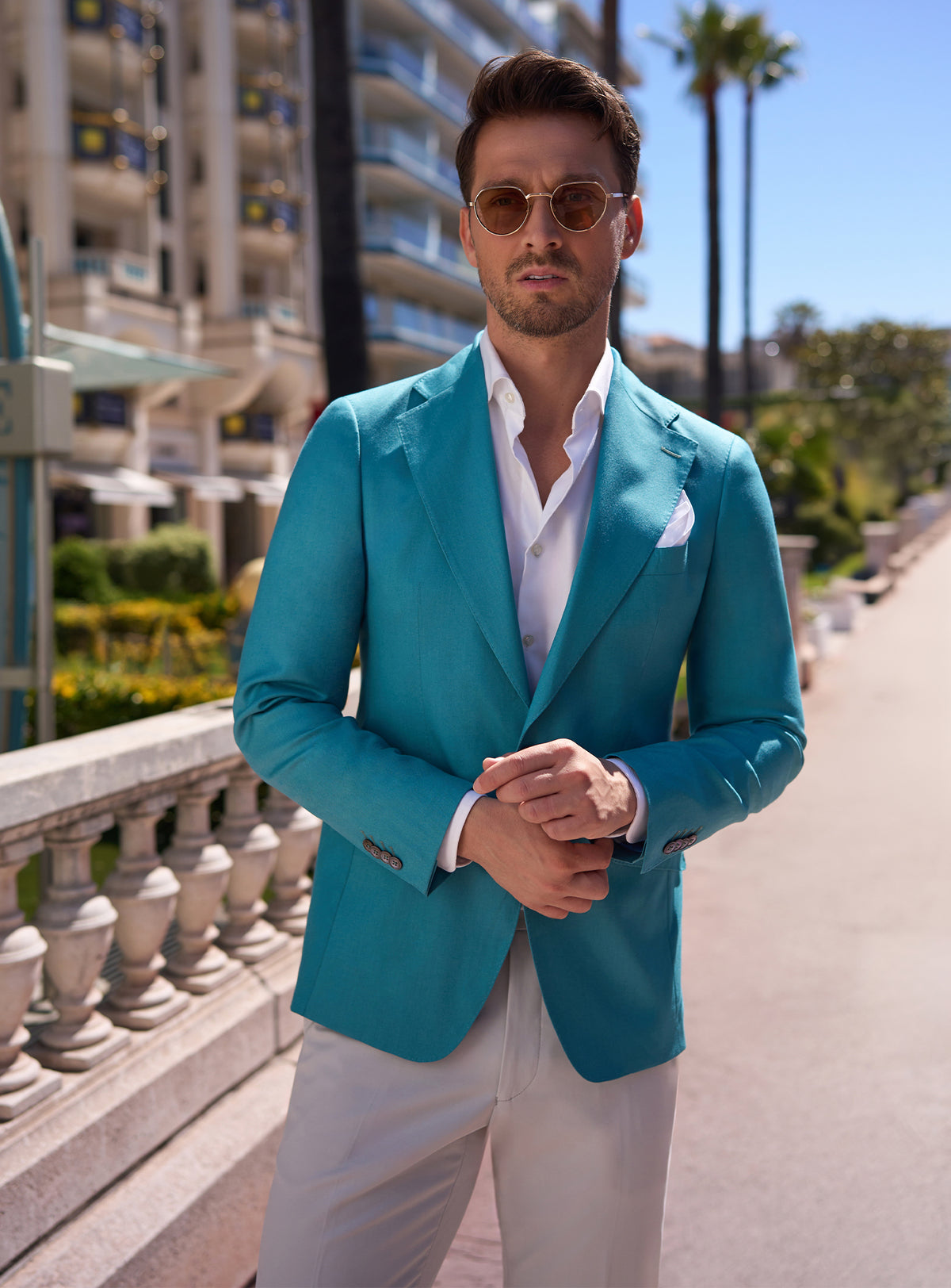 Turquoise Consiglieri jacket with a white shirt and pocket square