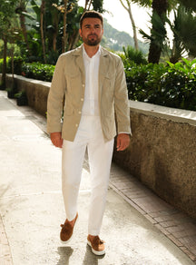 Beige Consiglieri jacket with patch pockets, styled with a white shirt and white trousers