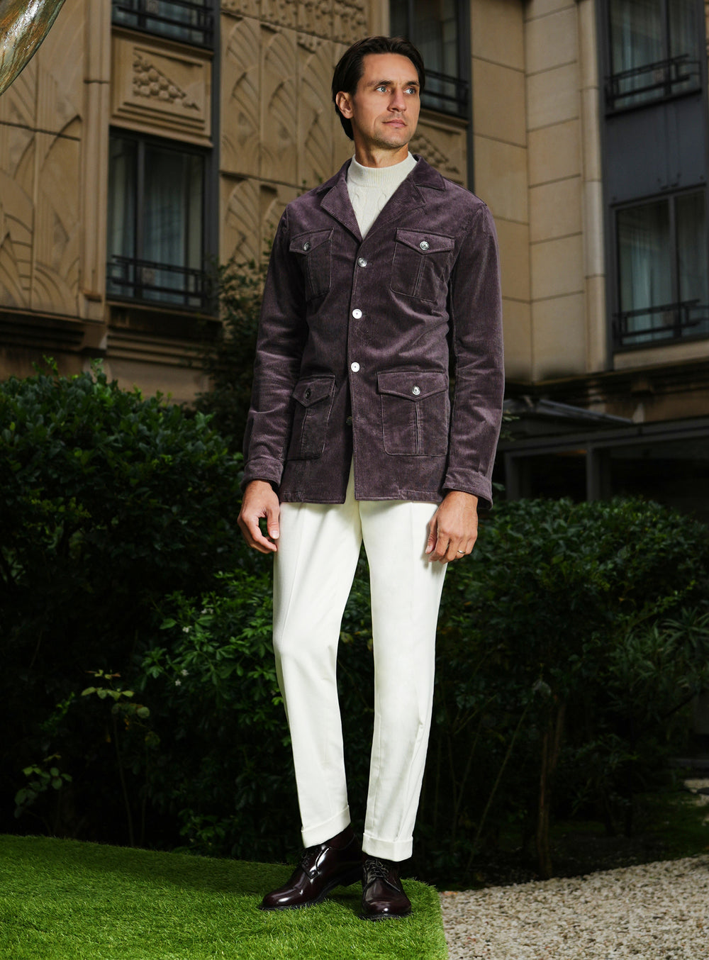 Plum-toned Consiglieri safari jacket with white trousers