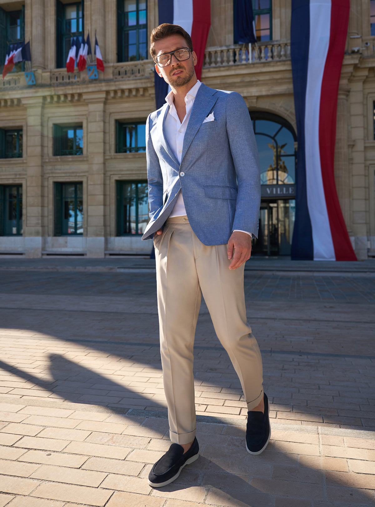 Pale blue Consiglieri jacket with beige trousers and dark loafers