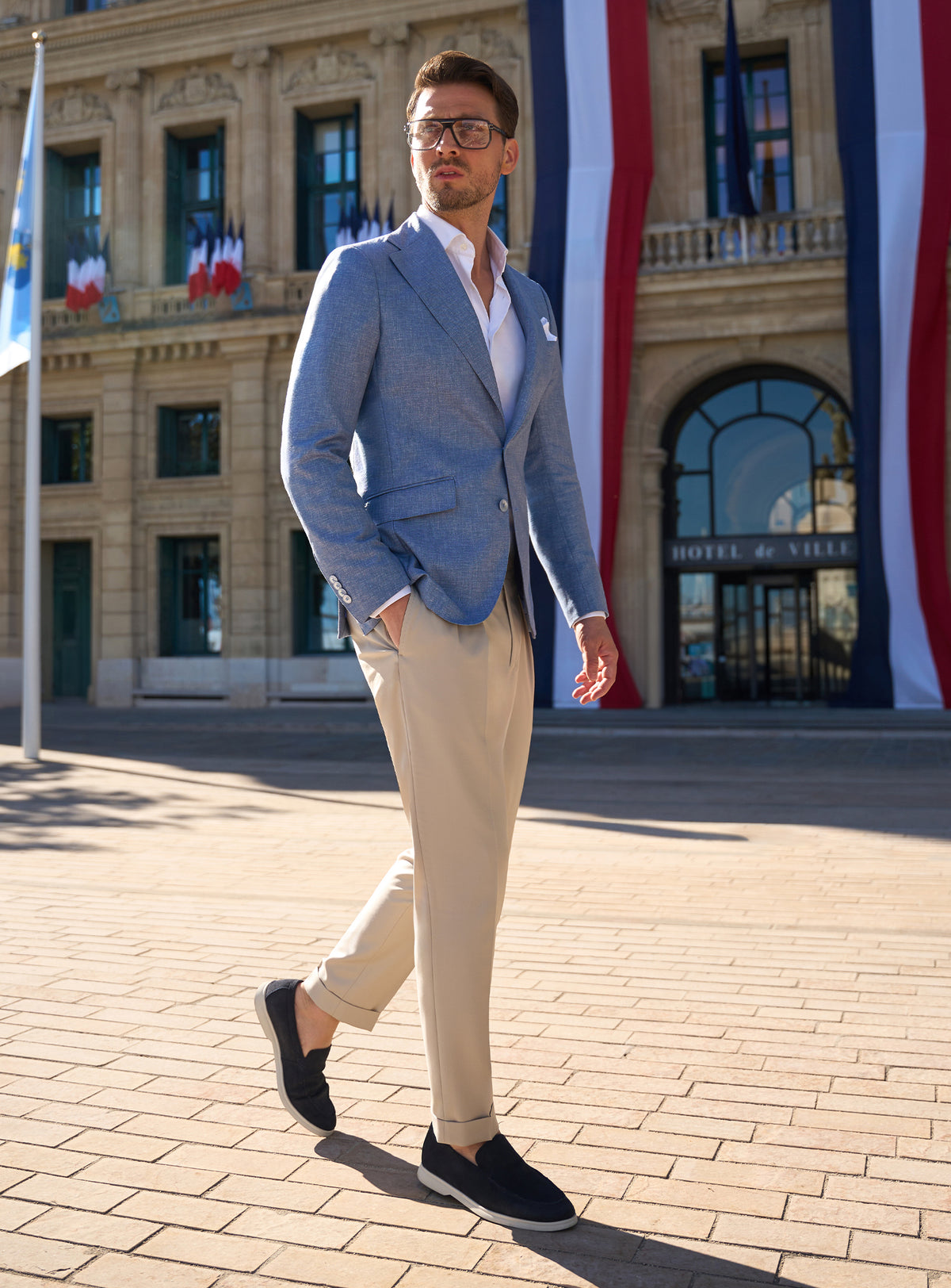 Pale blue Consiglieri jacket with beige trousers and dark loafers
