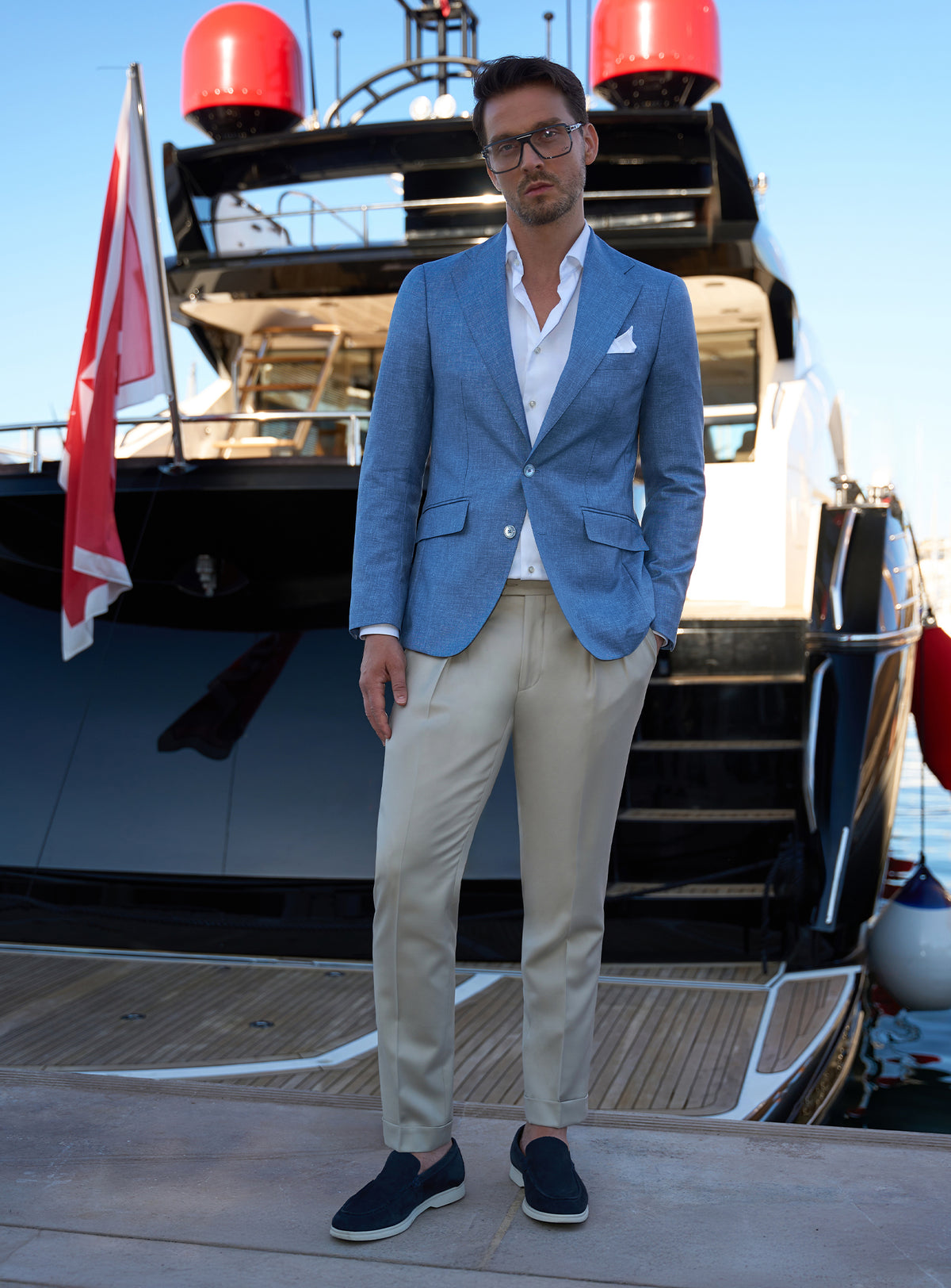 Pale blue Consiglieri jacket with beige trousers and dark loafers