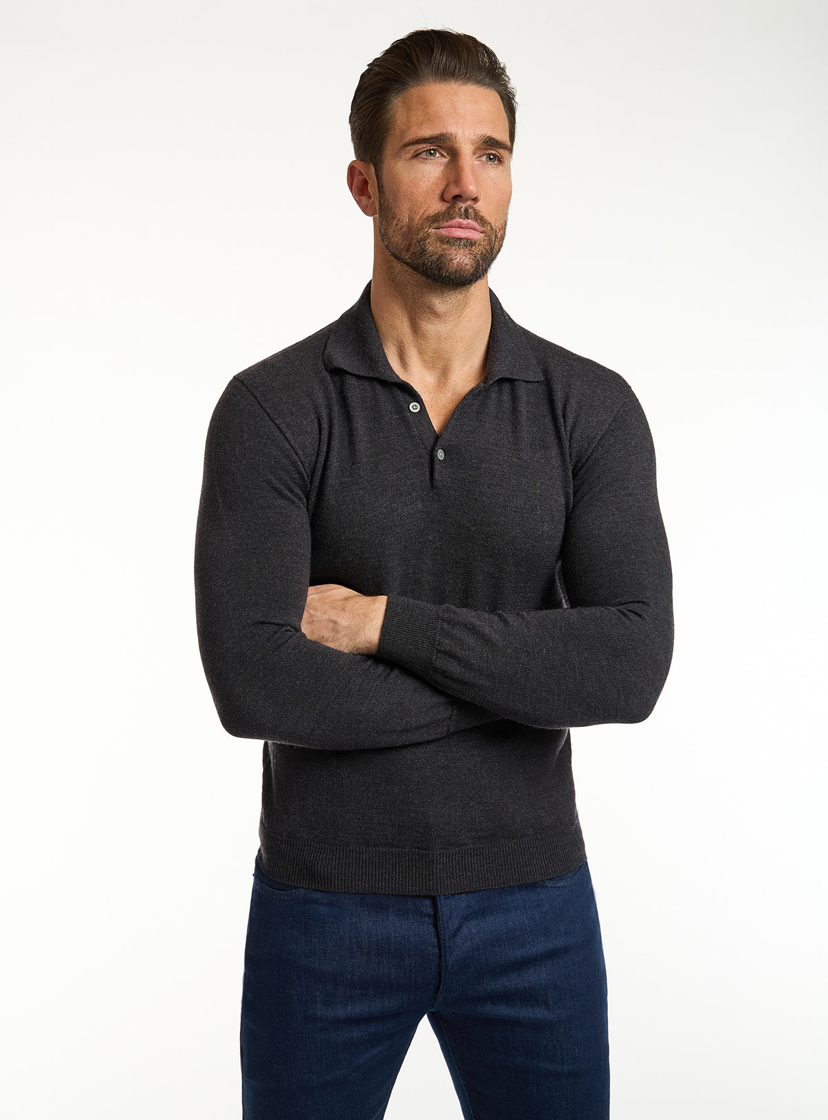 Consiglieri: black polo-collar sweater with navy jeans