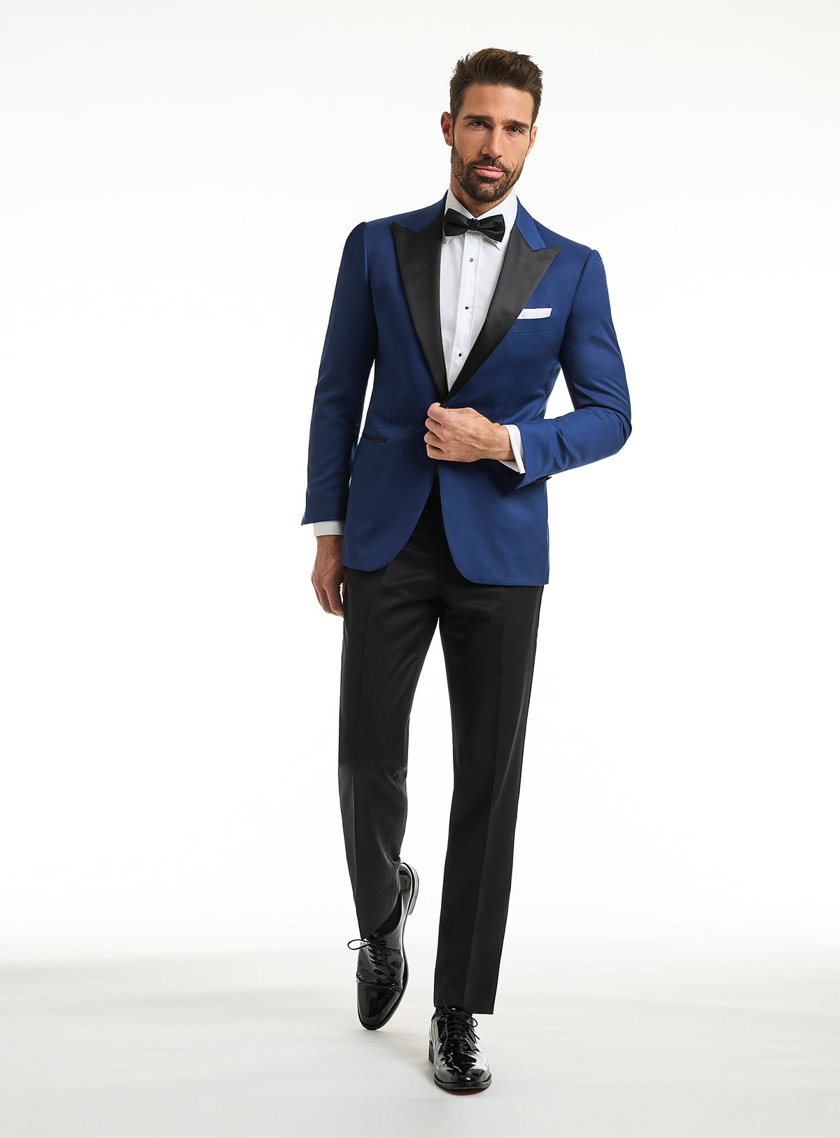 Consiglieri: rich blue tuxedo jacket with black lapels and black trousers