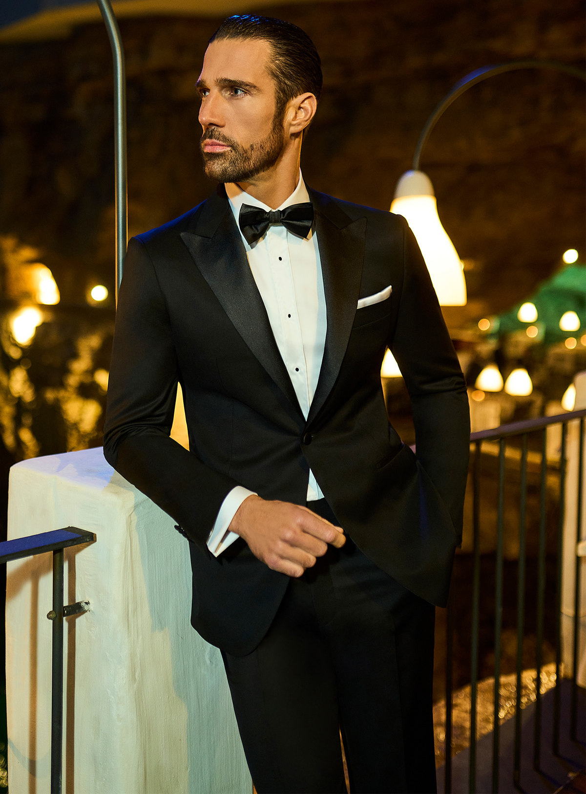 Consiglieri: black tuxedo with lustrous shawl lapels and a bow tie