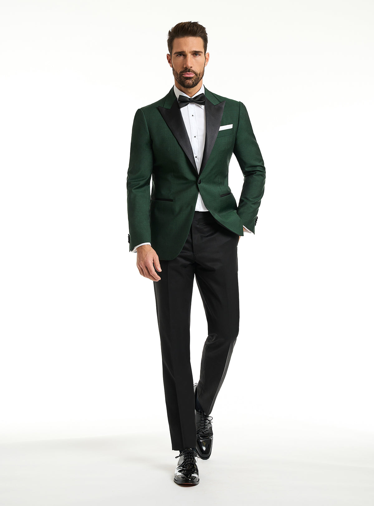 Consiglieri: emerald green tuxedo jacket with black lapels and black trousers