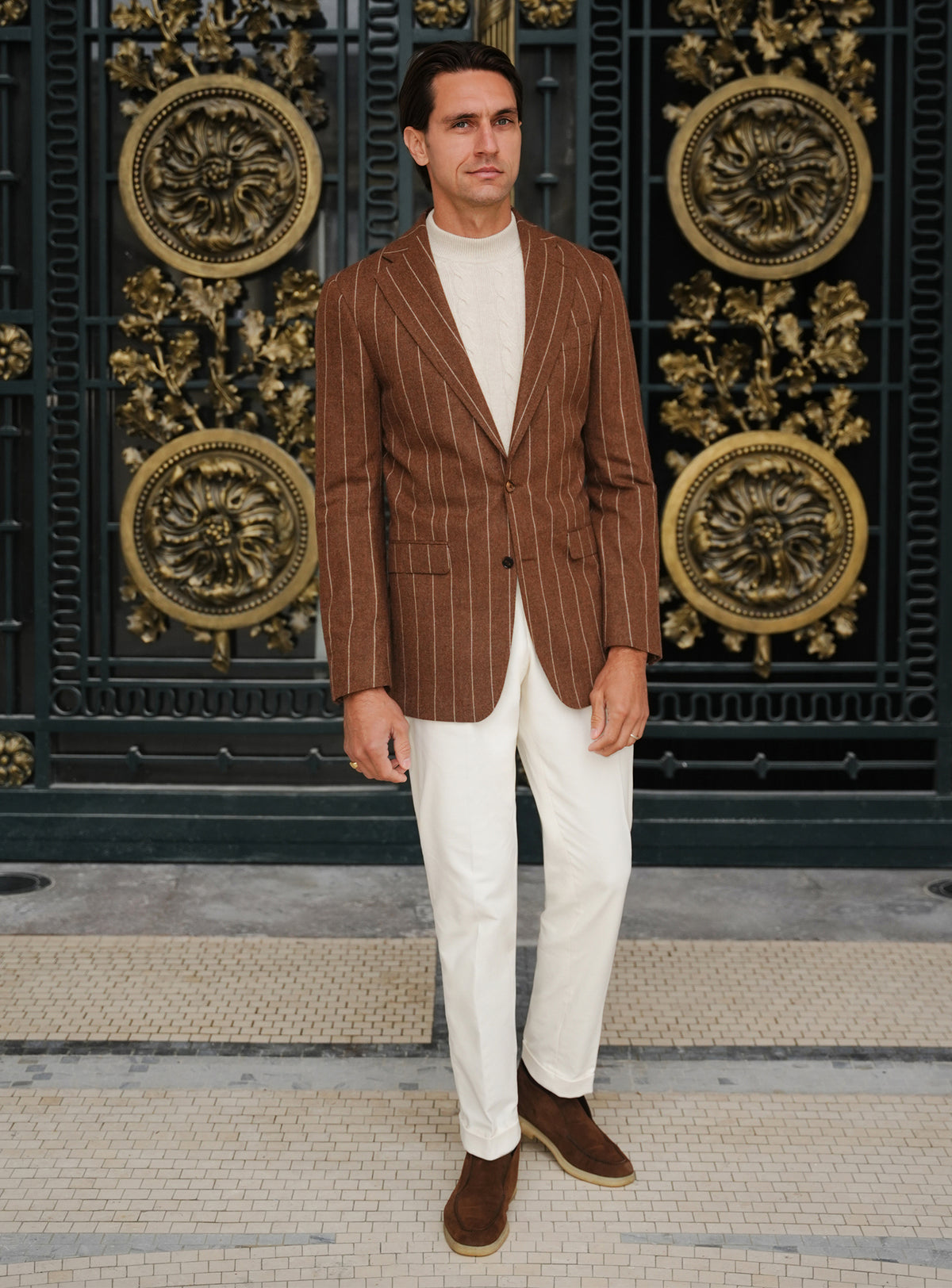 Brown Consiglieri jacket with light stripes, worn with white trousers
