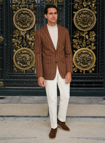 Brown Consiglieri jacket with light stripes, worn with white trousers