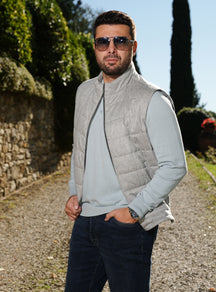 Light grey quilted Consiglieri gilet layered over a pale blue sweater