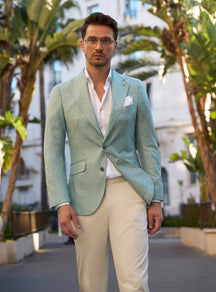 Mint green Consiglieri jacket with a white shirt and ivory trousers
