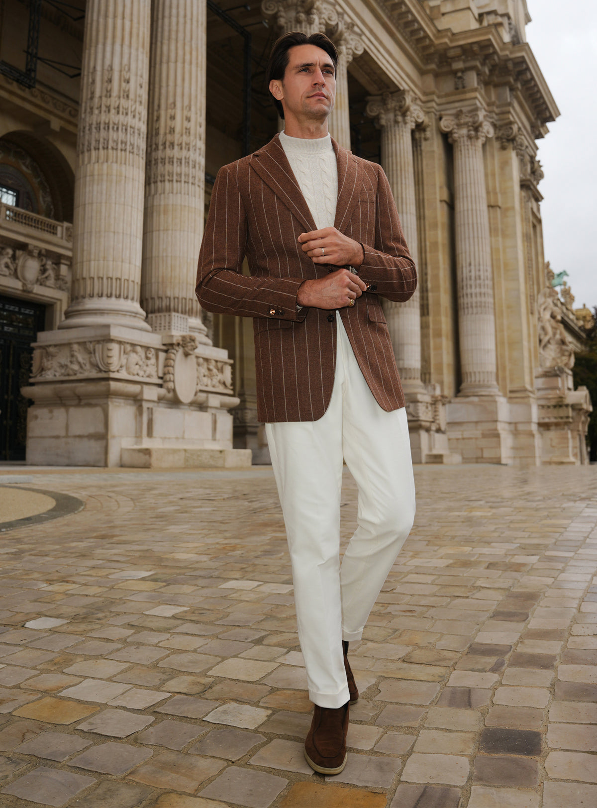 Brown Consiglieri jacket with light stripes, worn with white trousers