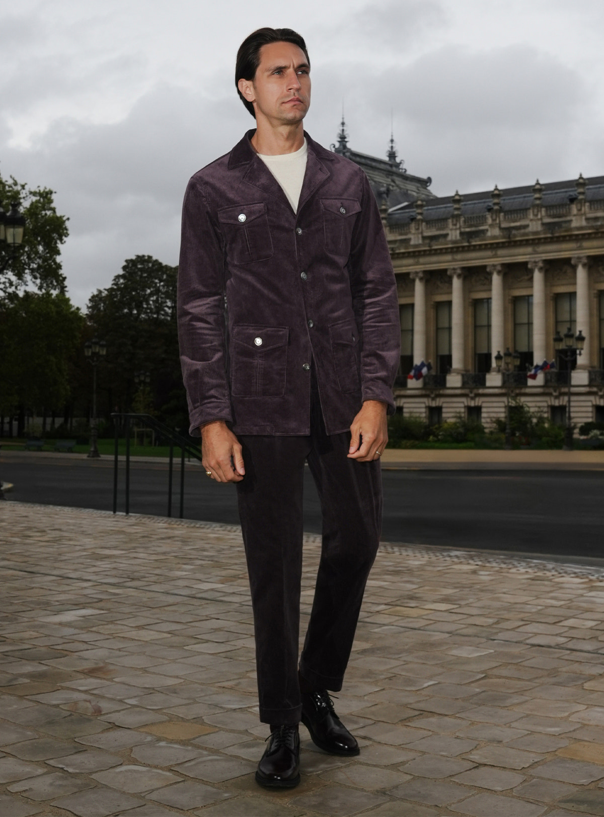Plum-toned Consiglieri safari jacket with patch pockets and dark trousers
