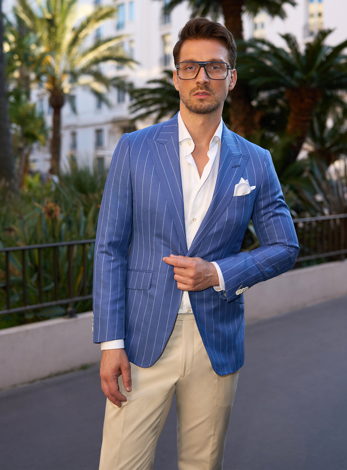 Blue pinstripe Consiglieri jacket with a white shirt and pocket square