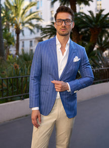 Blue pinstripe Consiglieri jacket with a white shirt and pocket square