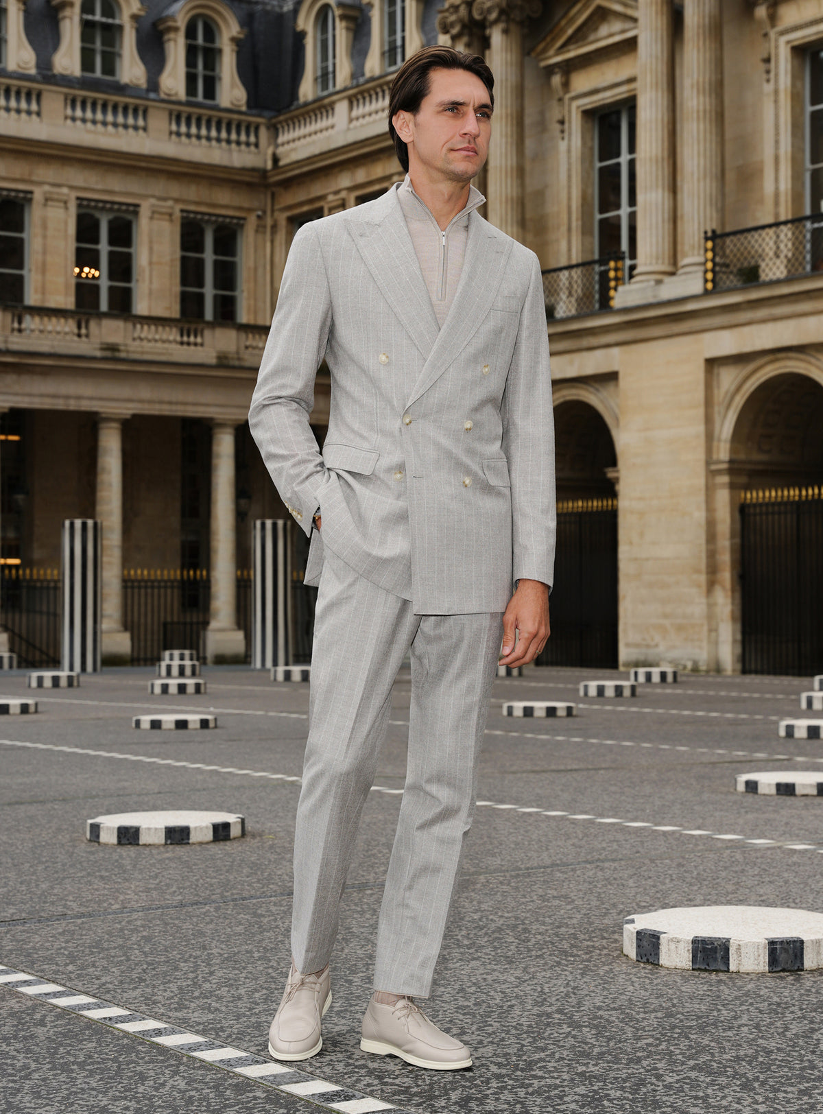 Light grey Consiglieri suit with a double-breasted jacket and ivory turtleneck