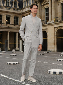 Light grey Consiglieri suit with a double-breasted jacket and ivory turtleneck