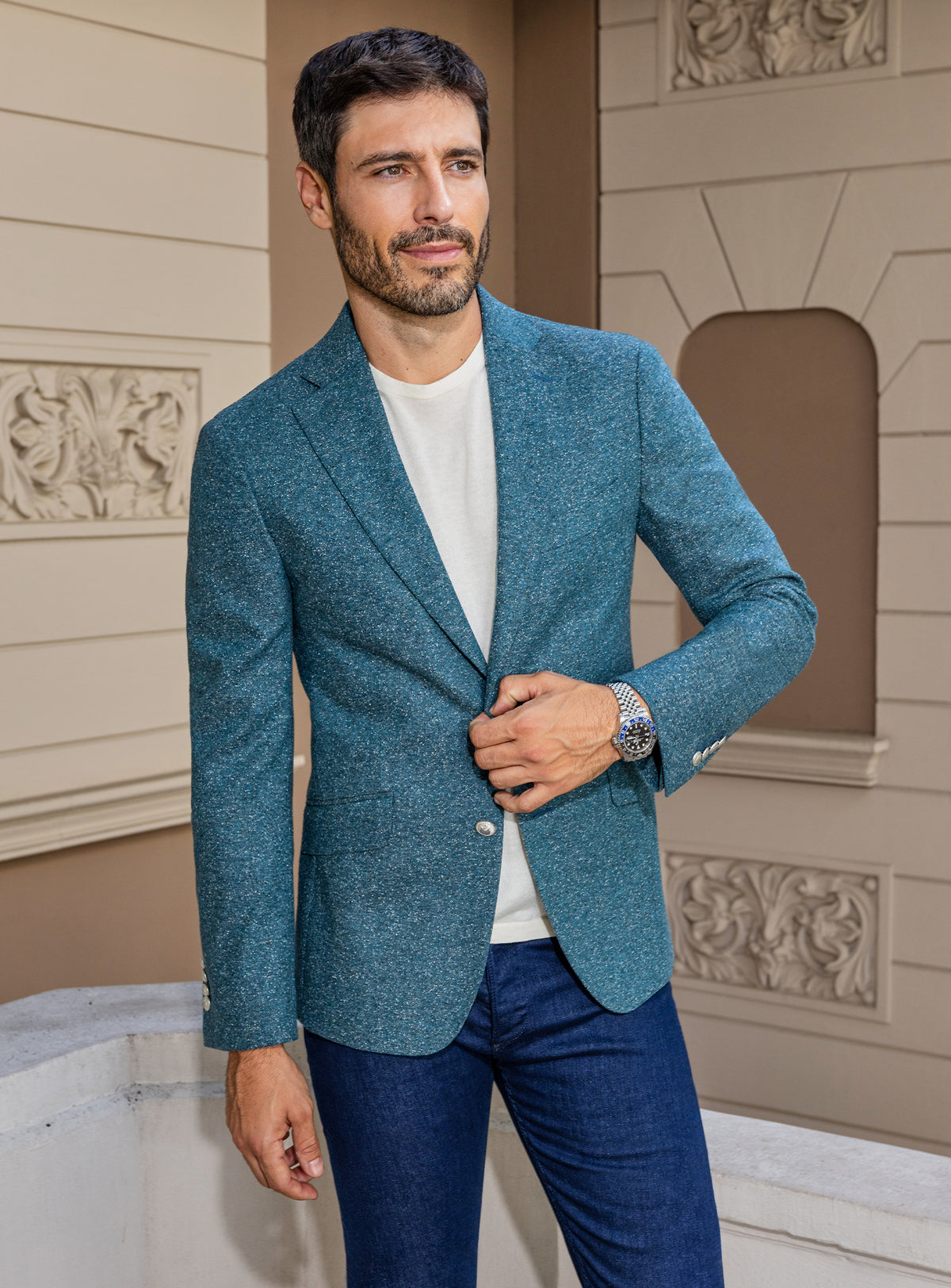 Consiglieri: petrol blue jacket with an ivory roll-neck and blue trousers
