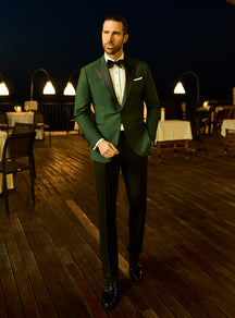 Consiglieri: emerald green tuxedo jacket with black lapels and a bow tie