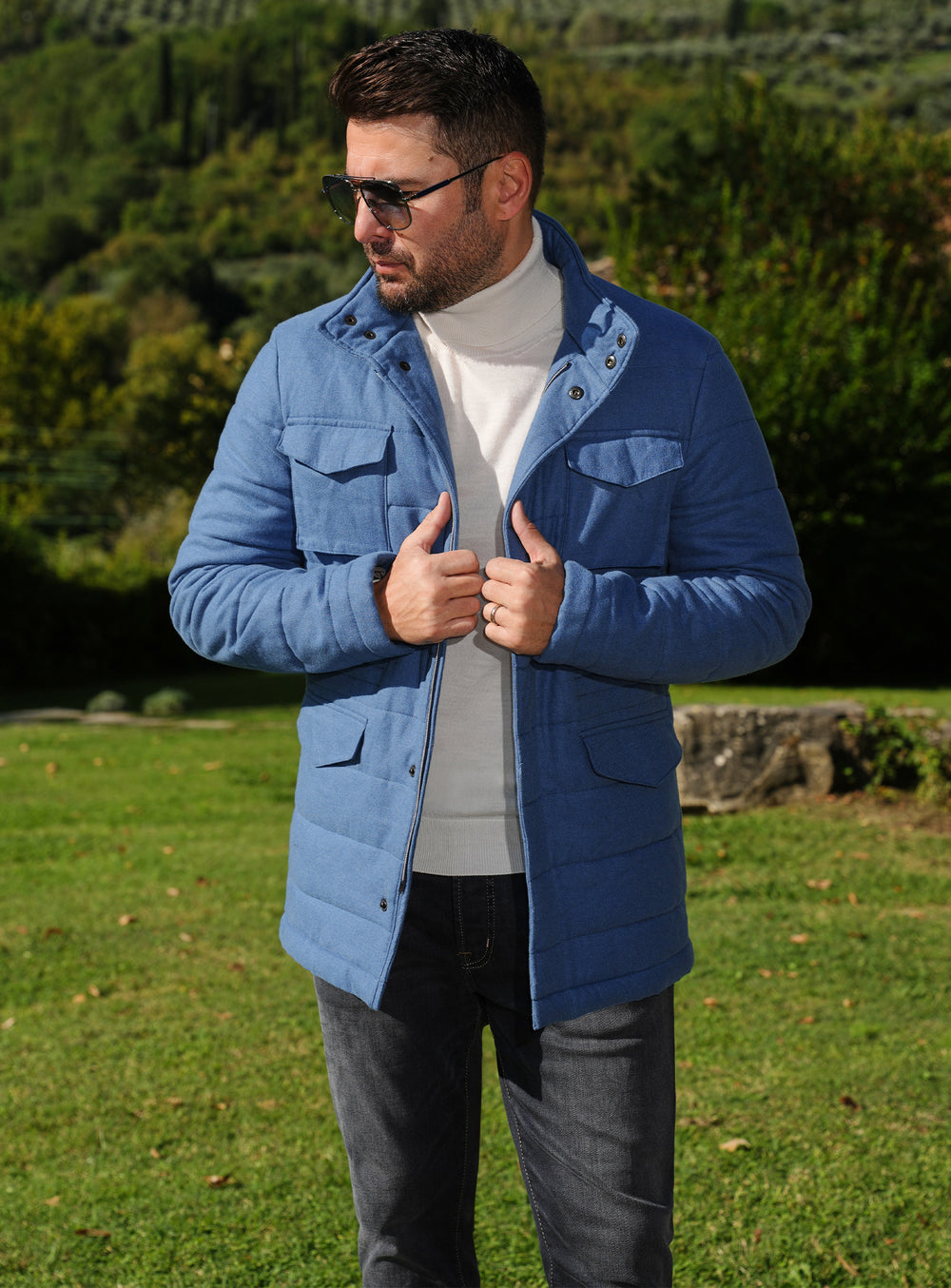 Blue Consiglieri jacket with patch pockets, worn with dark trousers