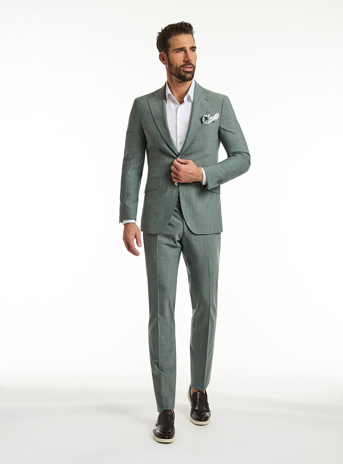 Consiglieri Catania Raffinata: textured sage green suit with a white shirt and patterned pocket square