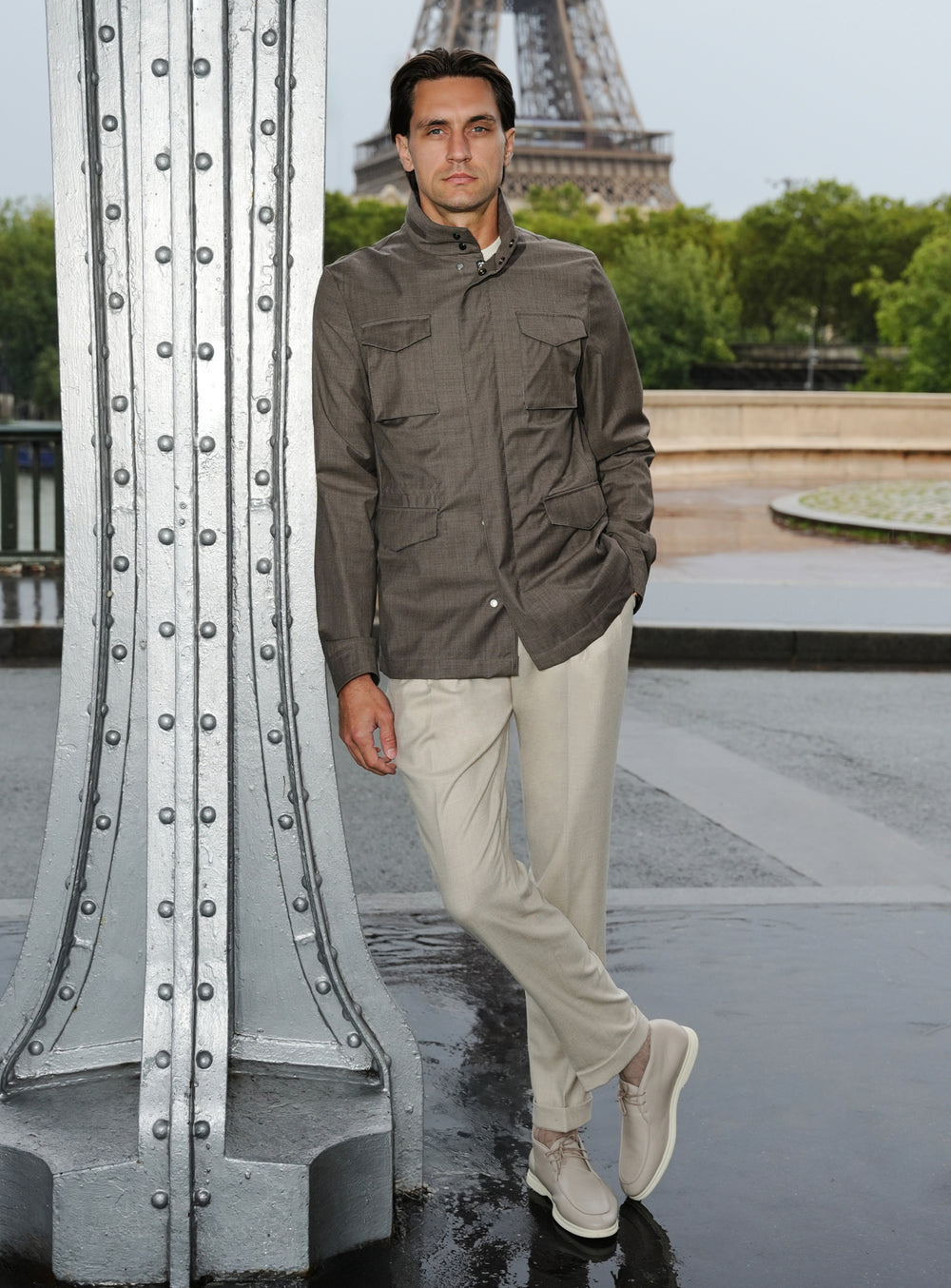 Khaki Consiglieri jacket with patch pockets, a cream cardigan and beige trousers