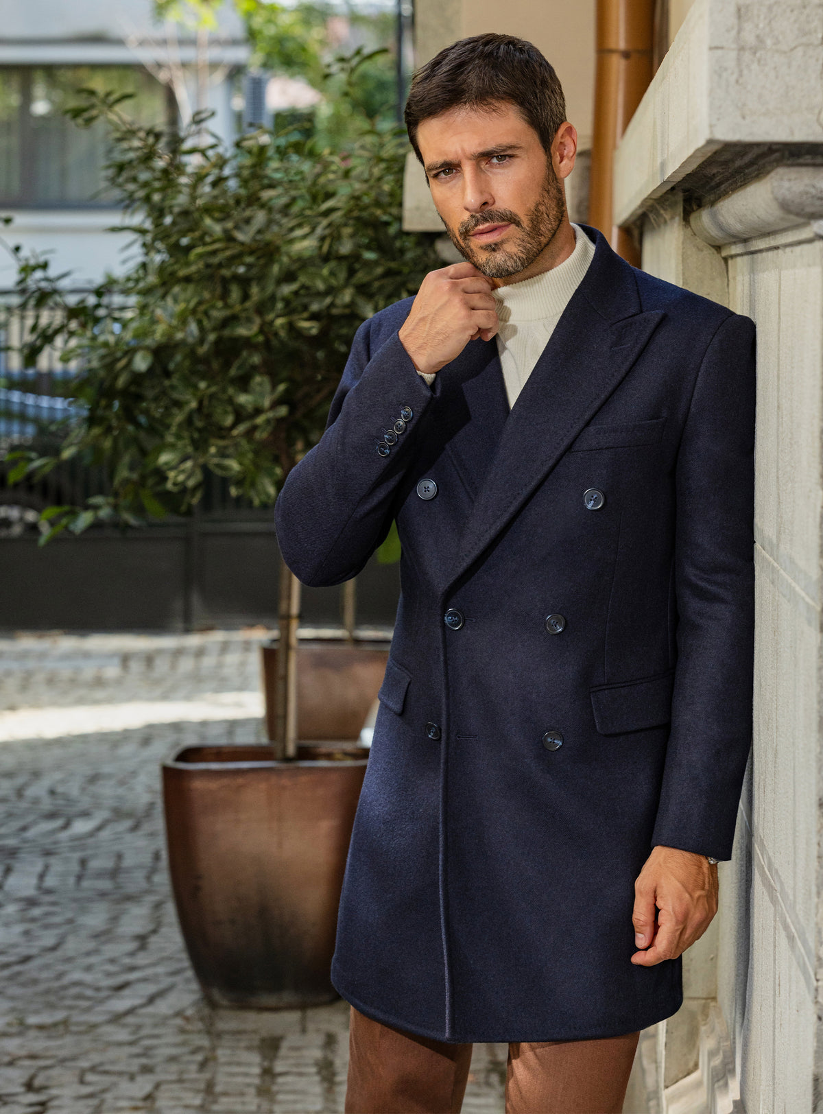 Consiglieri: navy double-breasted overcoat with an ivory roll-neck