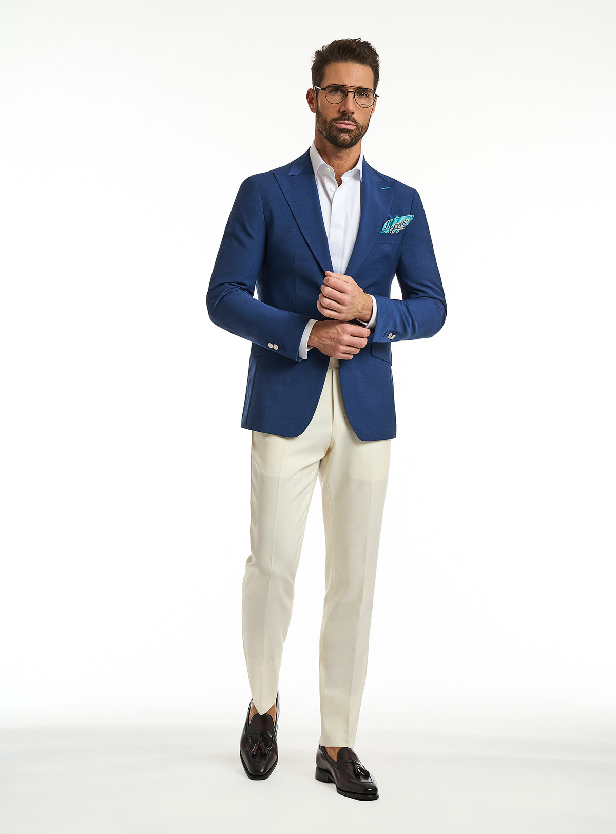 Consiglieri Toscana Stiloso: blue jacket with a green pocket square and cream trousers