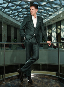 Dark green Consiglieri suit with a white shirt and black shoes
