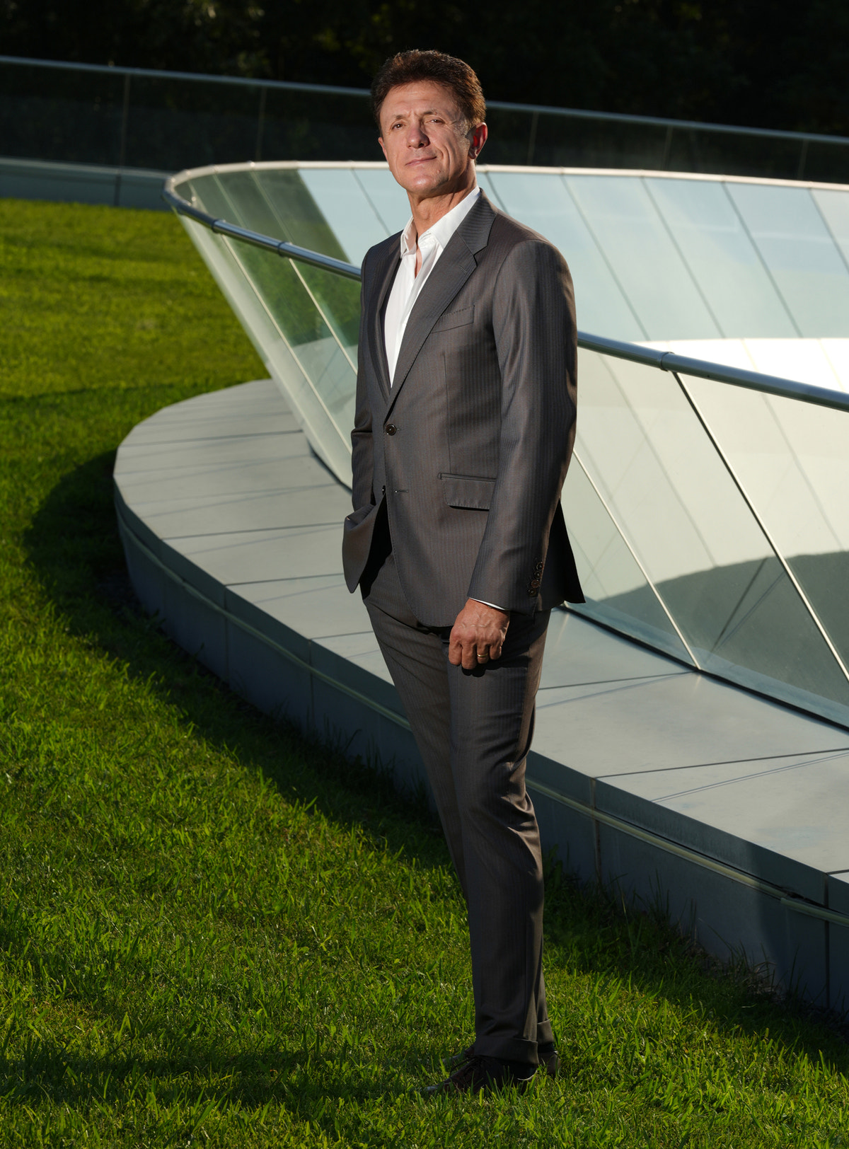 Dark-toned Consiglieri suit worn outdoors with a white shirt