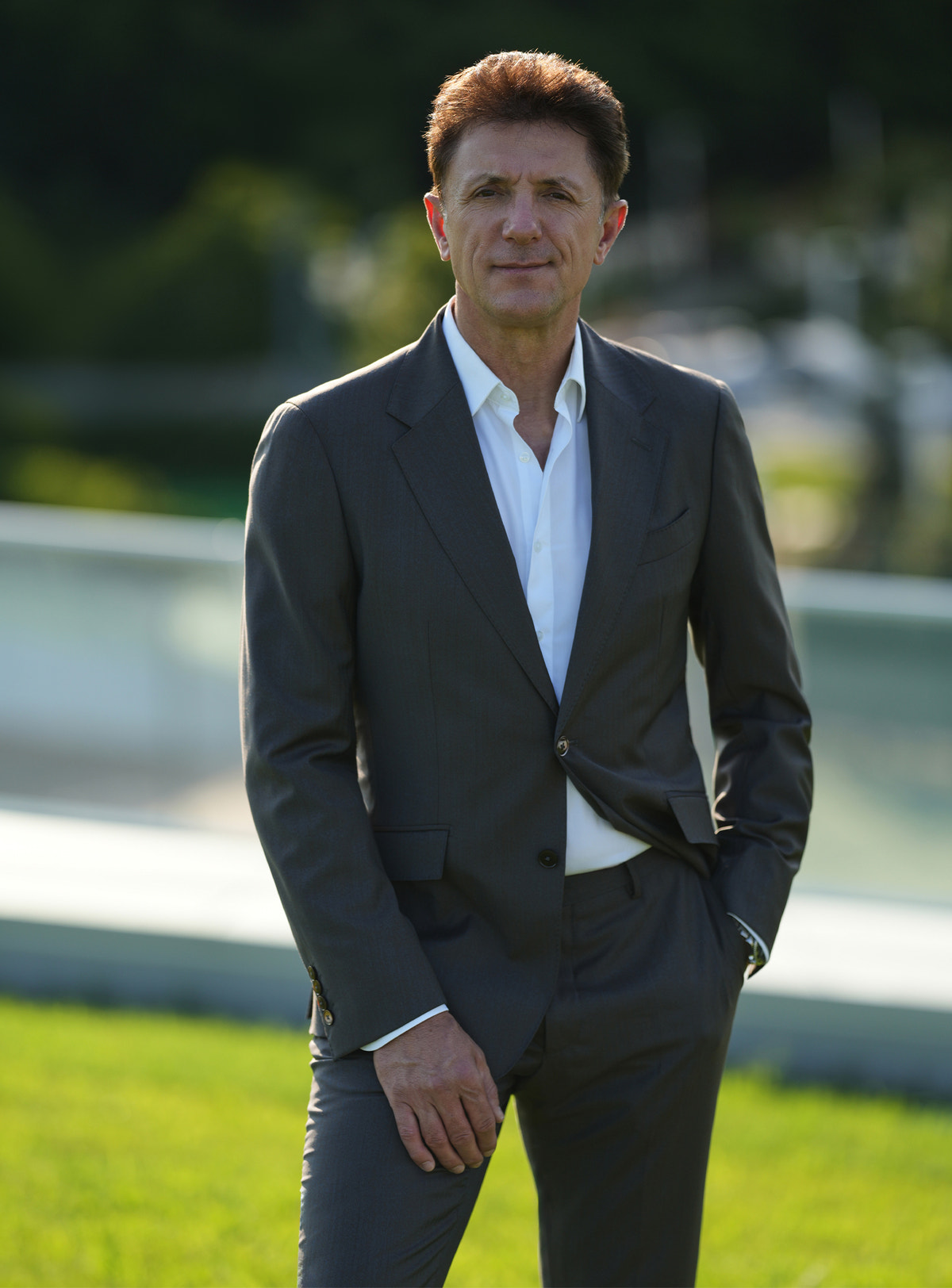 Dark-toned Consiglieri jacket worn with a white shirt and no tie