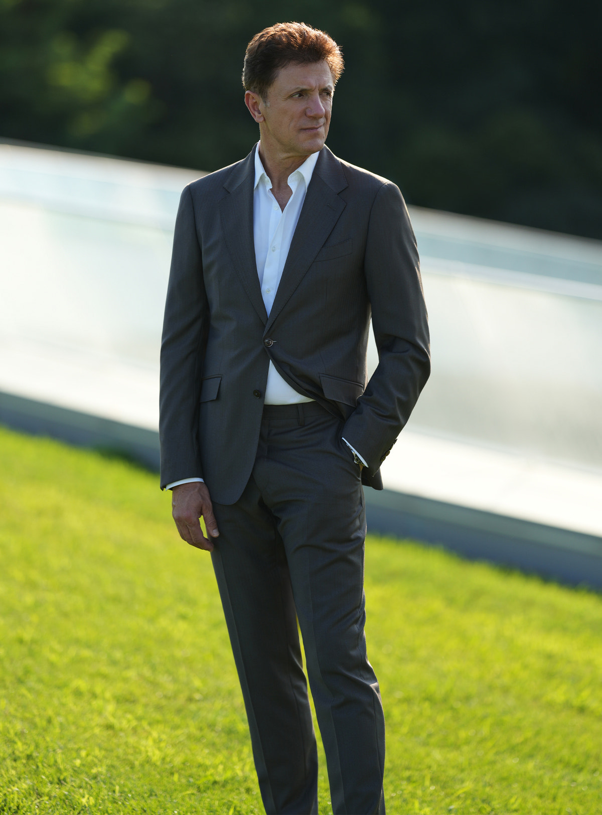 Dark-toned Consiglieri suit worn outdoors with a white shirt