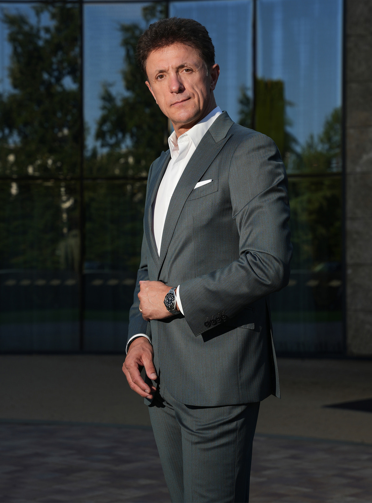 Grey-green Consiglieri jacket with a white shirt and pocket square