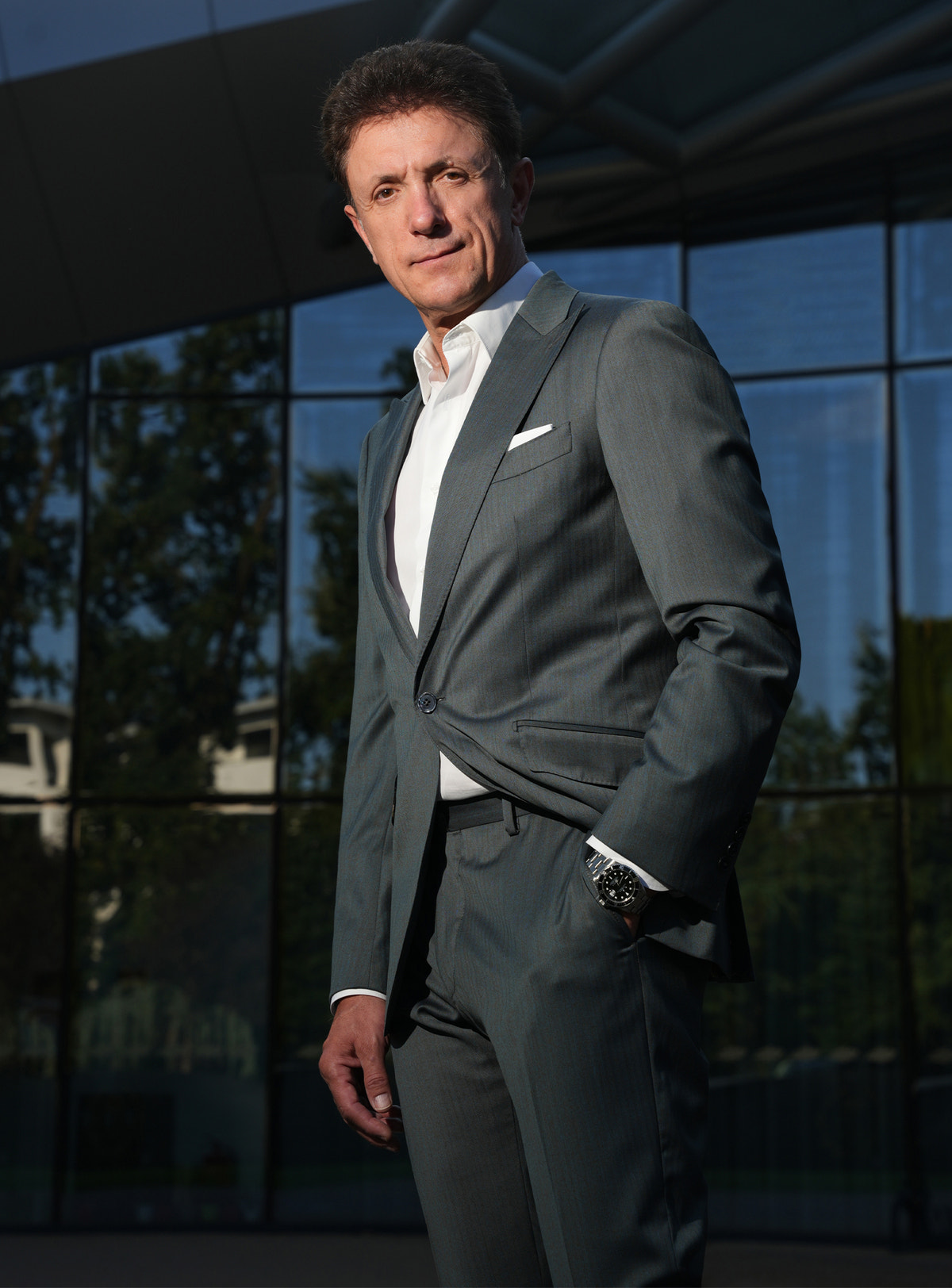 Grey-green Consiglieri jacket with a white shirt and pocket square