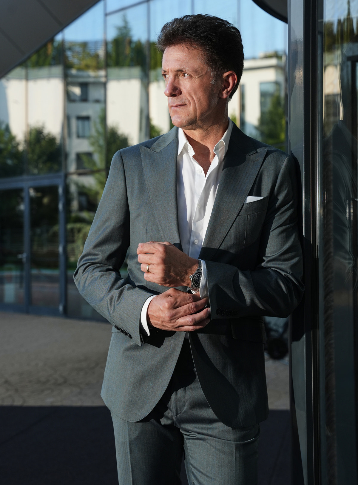 Grey-green Consiglieri jacket with a white shirt and pocket square