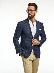 Consiglieri: navy checked jacket with a white polo and beige trousers