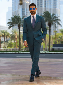 Consiglieri Royal Dignity: teal suit with a white shirt and navy tie
