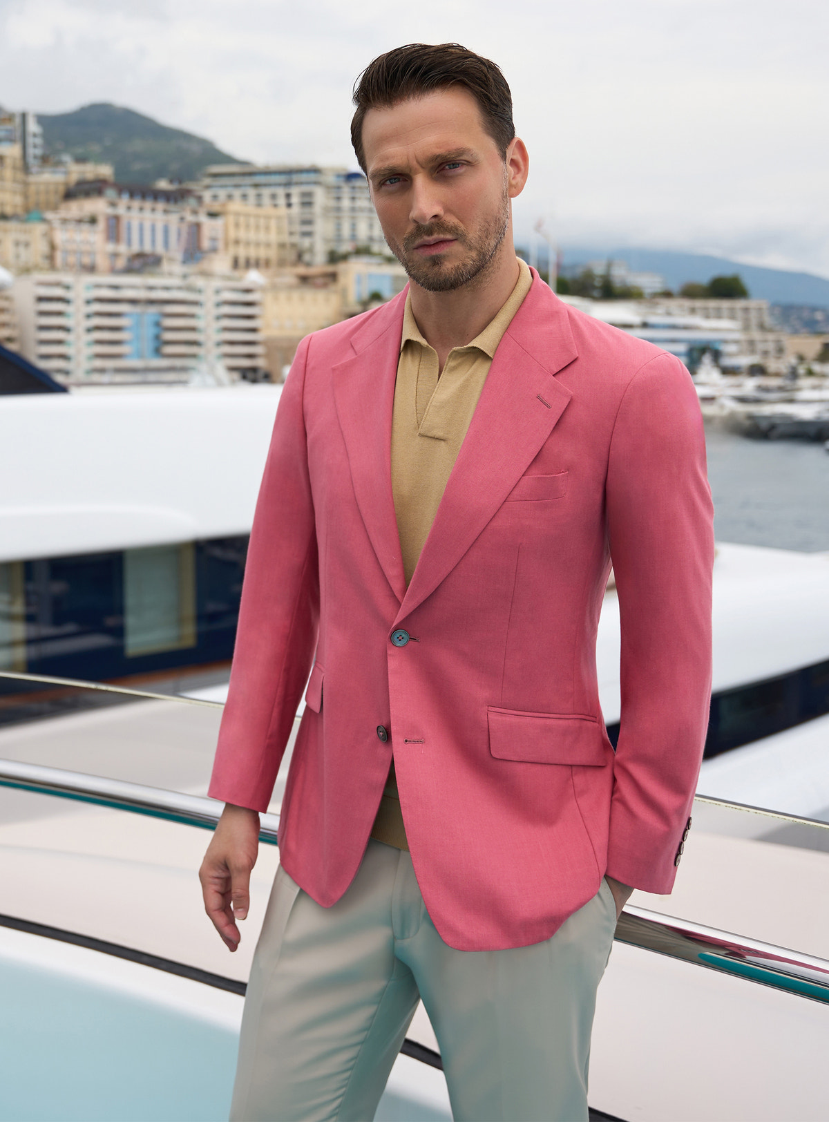 Pink Consiglieri jacket with an ochre polo shirt and light trousers